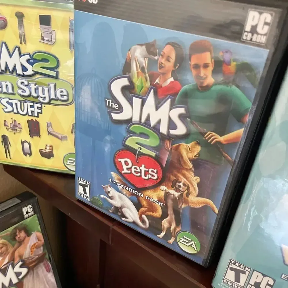 The SIMS PlayStation Vintage Side Video Game Lot PC DVD Pets Family Delux Sets